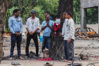 Air India employees pay a floral tribute to the victims of last month's Air India flight 171 crash, at the accident site in Ahmedabad
